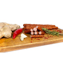 Delumani homemade sheep sausages, thinly sliced, showcasing traditional Romanian mezeluri with a rustic appearance